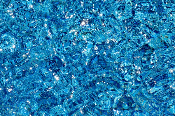 Hintergrund Des Blauen Poolwassers Mit Lichtreflexionen Und Wellen — Stockfoto