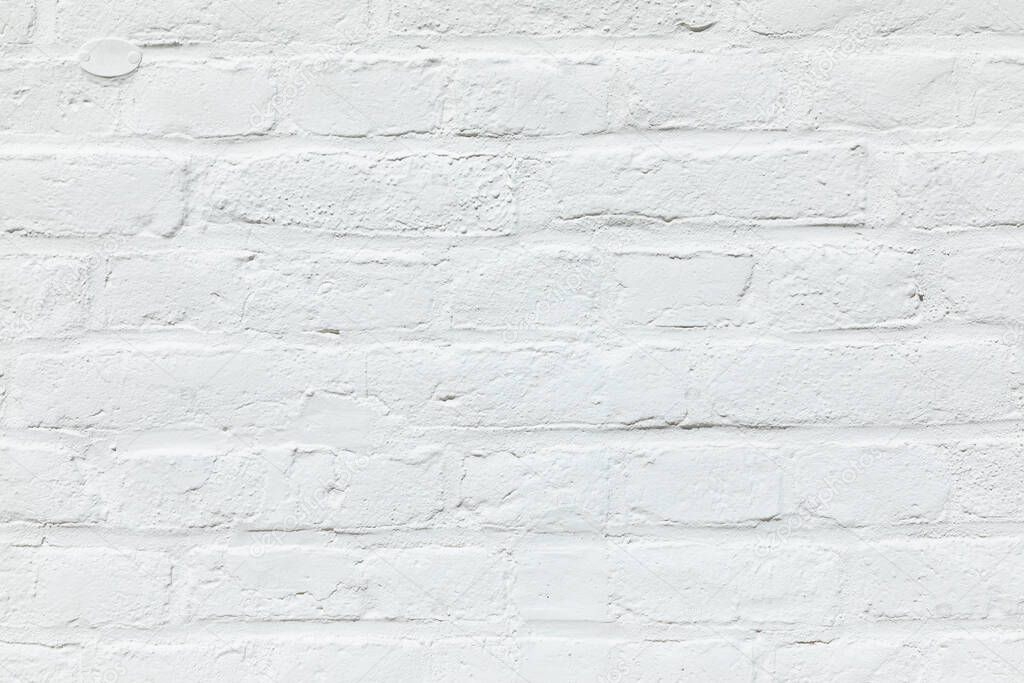 old white brick wall painted in white as harmonic background