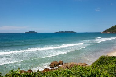 view to beach in saquinho in Santa catalina region, Florianopolis in Brazil clipart