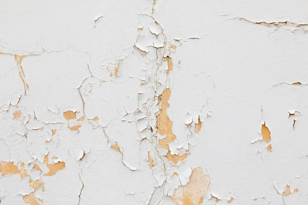 Beyaz eski bir duvar soyuluyor ve zaman geçirmek için harmonik bir sembol veriyor.