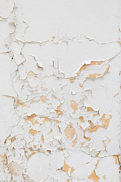 Beyaz eski bir duvar soyuluyor ve zaman geçirmek için harmonik bir sembol veriyor.