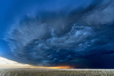 Large, powerful tornadic supercell storm moving over a field in Oklahoma sets the stage for the formation of tornados across Tornado Alley. clipart