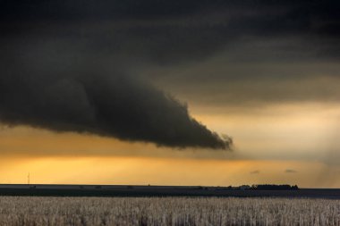 A large tornadic mesocyclone supercell inflow sucks in energy as it begins to transform into a tornado clipart