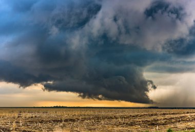 A large tornadic mesocyclone supercell inflow sucks in energy as it begins to transform into a tornado clipart