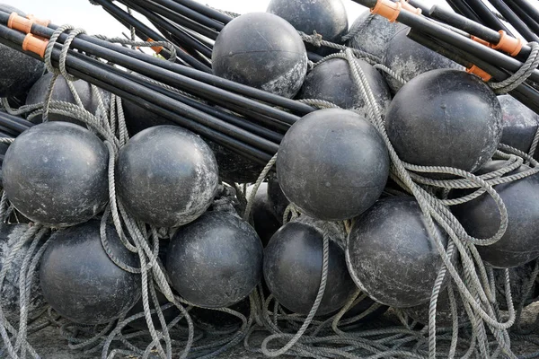 Black Spherical Plastic Floats Fishing Nets Out Water Port — Stock Photo, Image