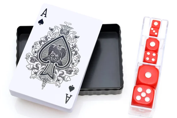 Playing cards and dice for game on white background