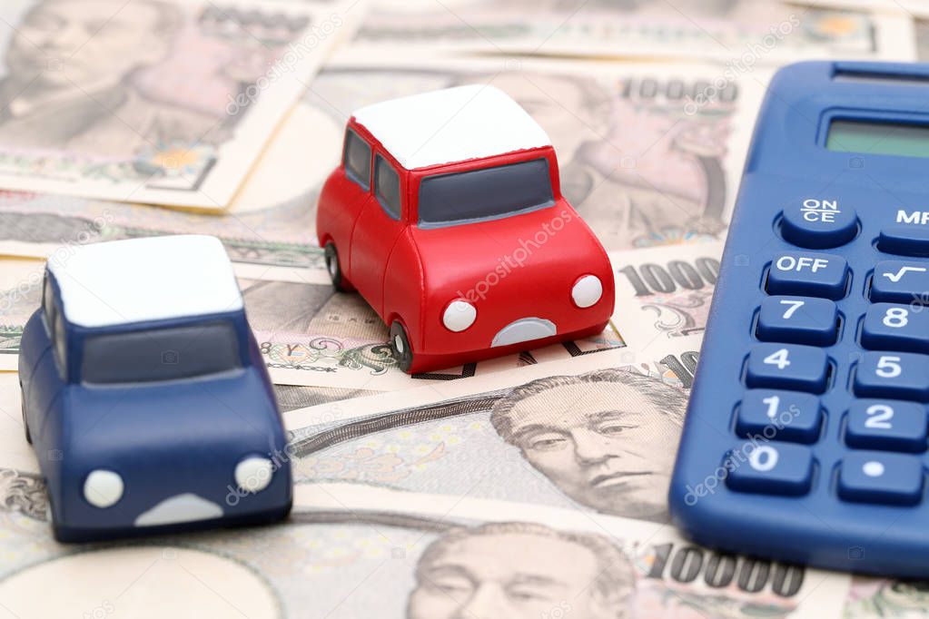 toy car and calculator with ten thousand japanese yen 