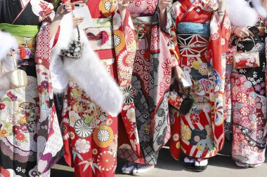 Young Japanese women wearing traditional kimono for the coming of age day celebration, they turn twenty in Kagawa, Japan.