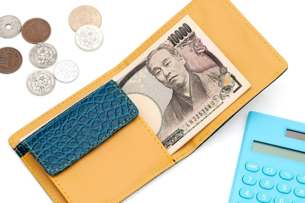 Dompet Kulit Dan Sepuluh Ribu Yen Jepang Latar Belakang Putih — Stok Foto