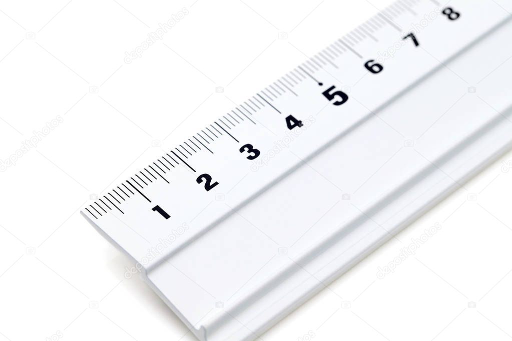 close up of steel ruler isoalted on a white background