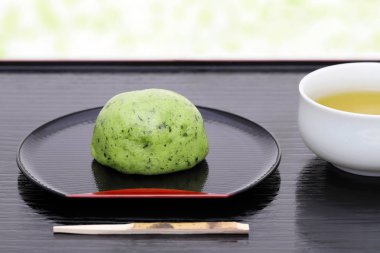 Japanese kusa mochi dessert for spring season yomogi plant made of rice cake  clipart