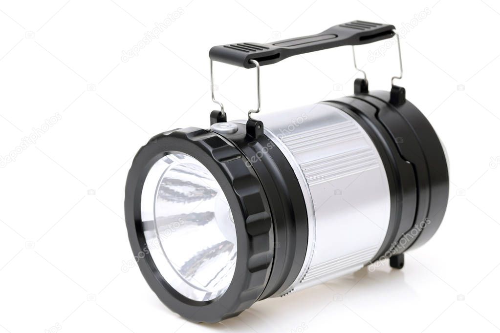 Electric led pocket flashlight on white background 