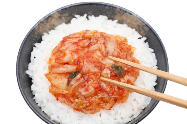 Korean food, cooked white rice with kimchi on white background