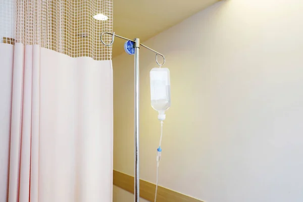 Infusion IV drip saline solution bottle medical in patient room