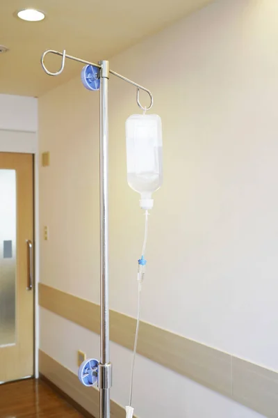 Infusion IV drip saline solution bottle medical in patient room