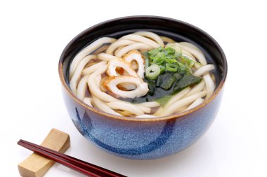 Japanese Kake udon noodles in a bowl on white background    clipart