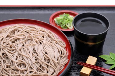 Japanese Zaru soba noodles on wooden plate on white background  clipart
