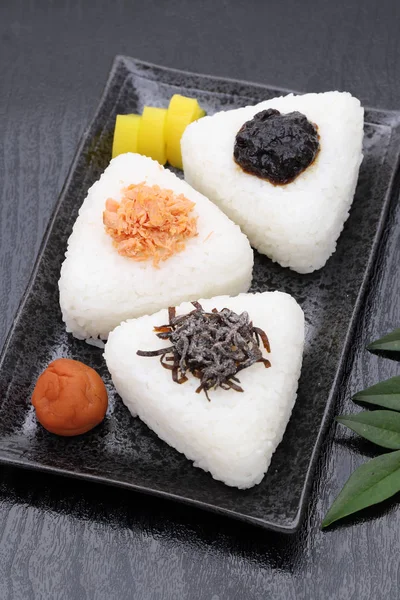 Onigiri, Japanese food, Japanese rice ball, rice triangle with takuan and umeboshi