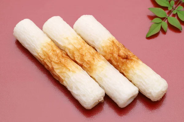 Japanisches Essen Chikuwa Kamaboko Auf Rotem Hintergrund — Stockfoto