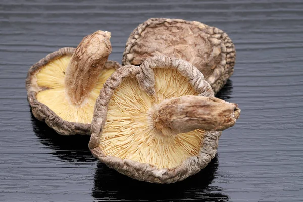 Japanese dried shiitake mushrooms on black background