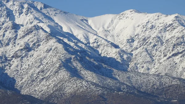 Landscape of mountain snow, city and clouds in Santiago Chile