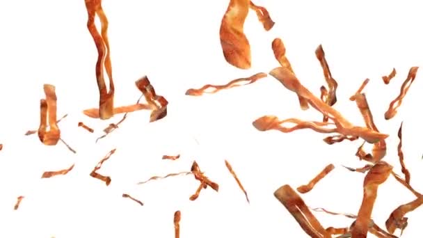 Fried bacon flying in slow motion against white — Stock Video