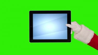 Noel Baba bir tablet sunar sonra bir öpücük gönderir ve hoşça kal der, Yeşil Ekran