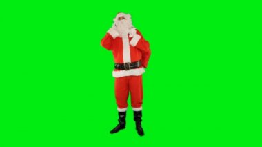 Noel Baba cep telefonunda hediyelerle dolu çantasıyla konuşuyor, Yeşil Ekran Chromakey.