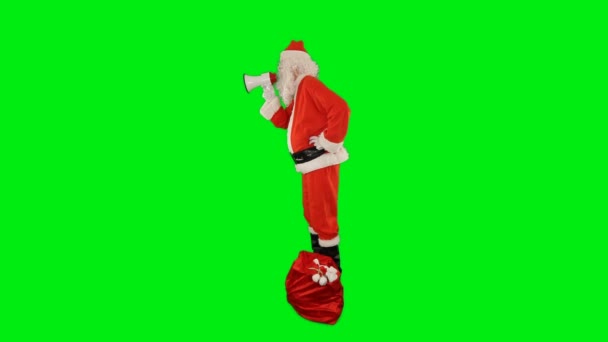 Bir Çanta Dolusu Hediyeyle Noel Baba Megafonla Bağırıyor Yandan Bakıyor — Stok video