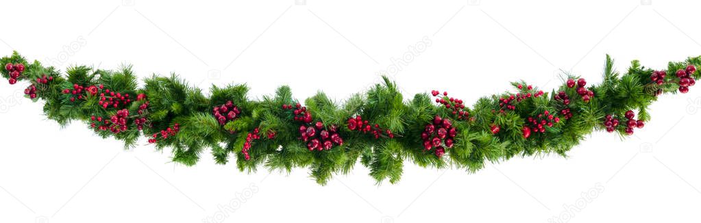 Christmas garland with red berries, isolated on white.