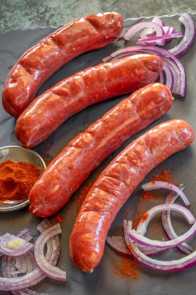 Fresh Uncooked Chorizo Sausages Paprika Red Onion Side View Dark — Stock Photo, Image