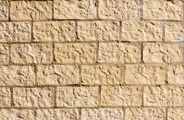 stone Foundation, the texture of decorative stone, painted in yellow