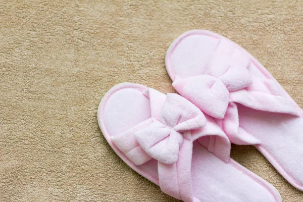 soft pink Slippers on a soft rug