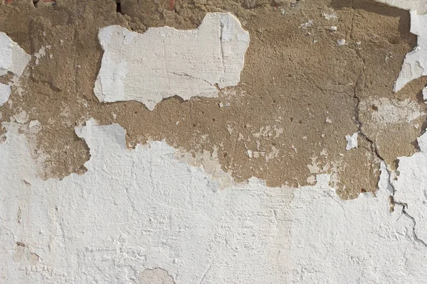 old wall with fallen off plaster