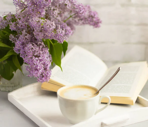 Cup Hot Coffee Milk Bouquet Lilacs Open Book Table Rest — Stock Photo, Image