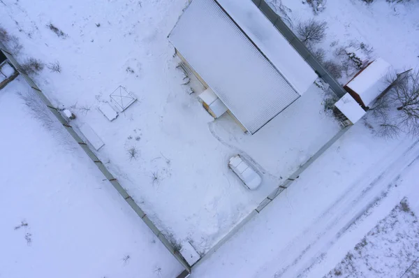 Aerial drone image of the roof of a suburban house during winter — Stock Photo, Image