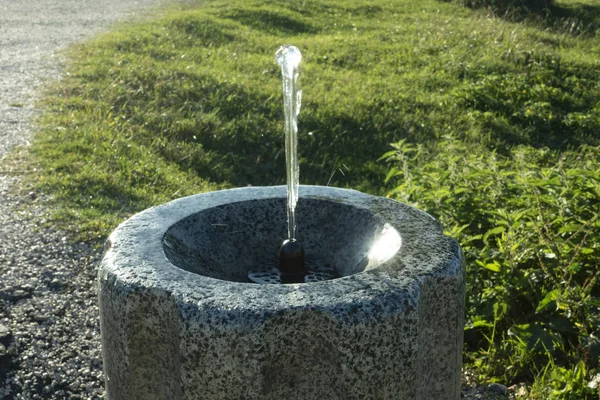 Water streaming from drinking fountain