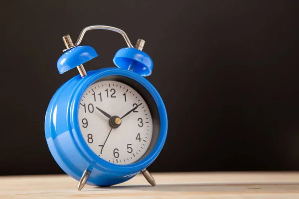 classic blue alarm clock morning time