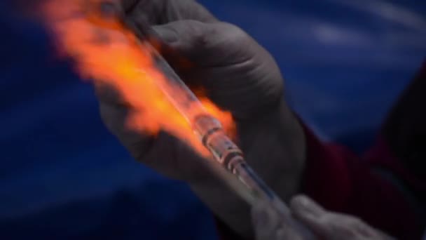 Craftsman glassblower at work. Handmade glass. Fire and glass are melting. Gas burner and flame — Stock Video