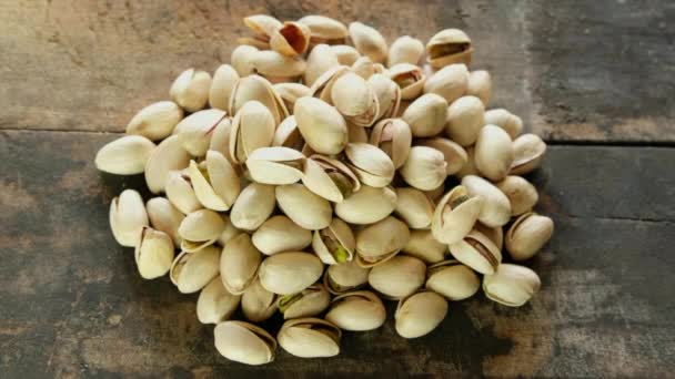 Tasty Pistachios Nuts Isolated Wooden Background — Stock Video