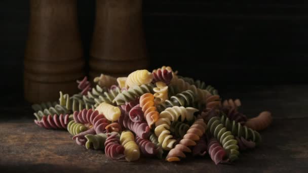 Dried Colored Fusilli Pasta Wooden Board — Stock Video