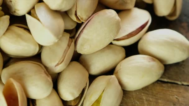 Tasty Pistachios Nuts Isolated Wooden Background — Stock Video