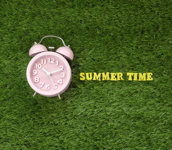 Pink Alarm Clock Summer Time Text Green Grass — Stock Photo, Image