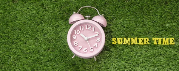 Pink Alarm Clock Summer Time Text Green Grass — Stock Photo, Image