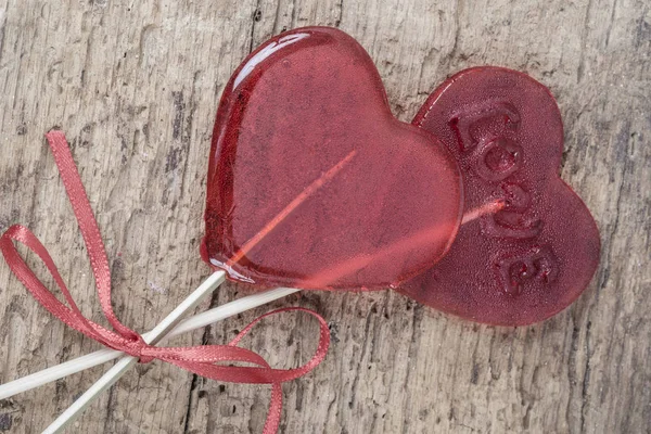 Heart Shaped Red Candies Wooden Table Copy Space Stock Image