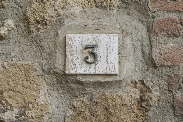 number three on a wall with copy space