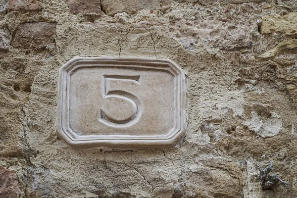 number five on a wall with copy space