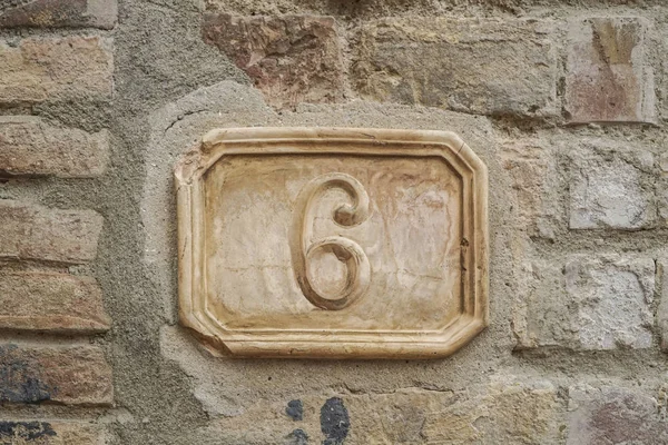 number six on a wall with copy space