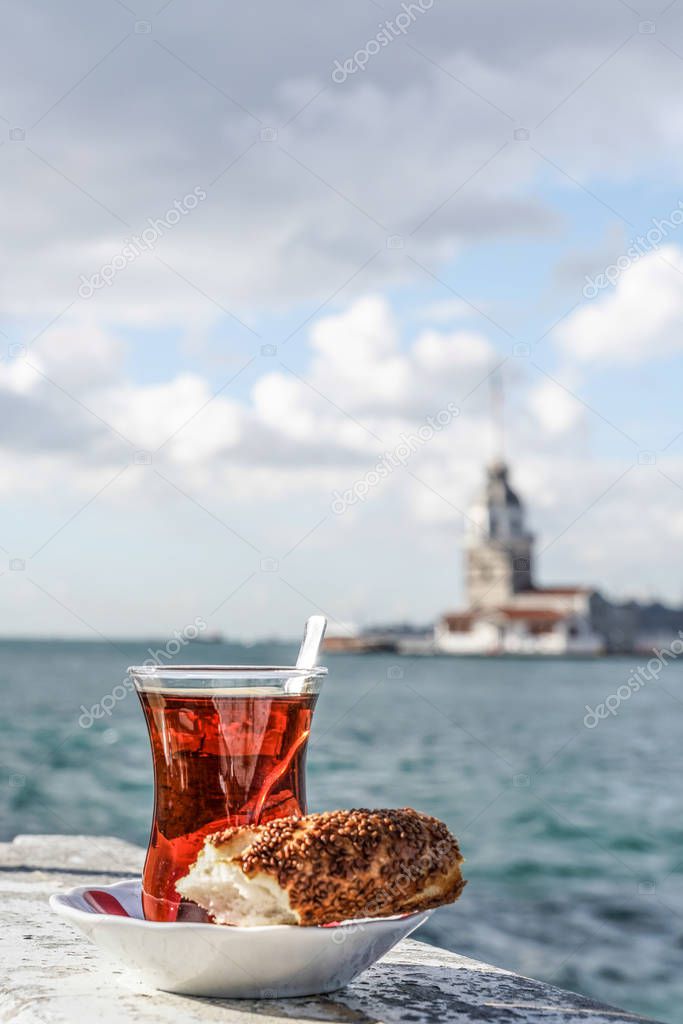 Turkish tea and bagel against sea and Maidens Tower in istanbul,