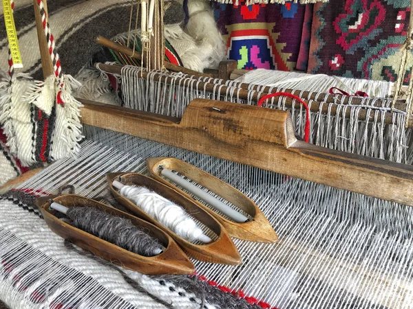 closeup of a manual carpet loom in Romania